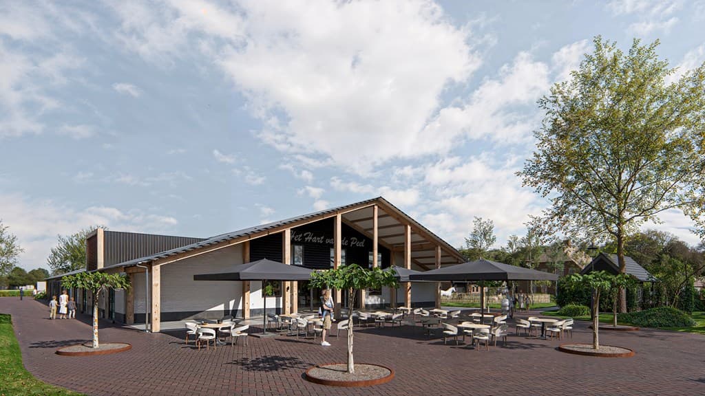 Moderne recreatievoorziening met terras, parasols en groene omgeving, gelegen langs een verharde route.
